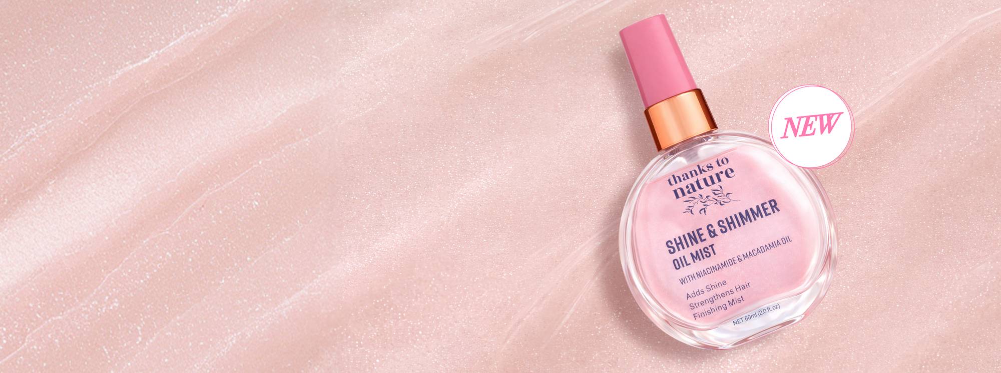 Thanks to Nature Shine & Shimmer Oil mist on a pink background