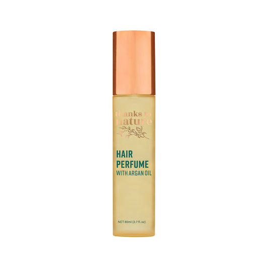 Hair perfume bottle with a copper cap on a white background