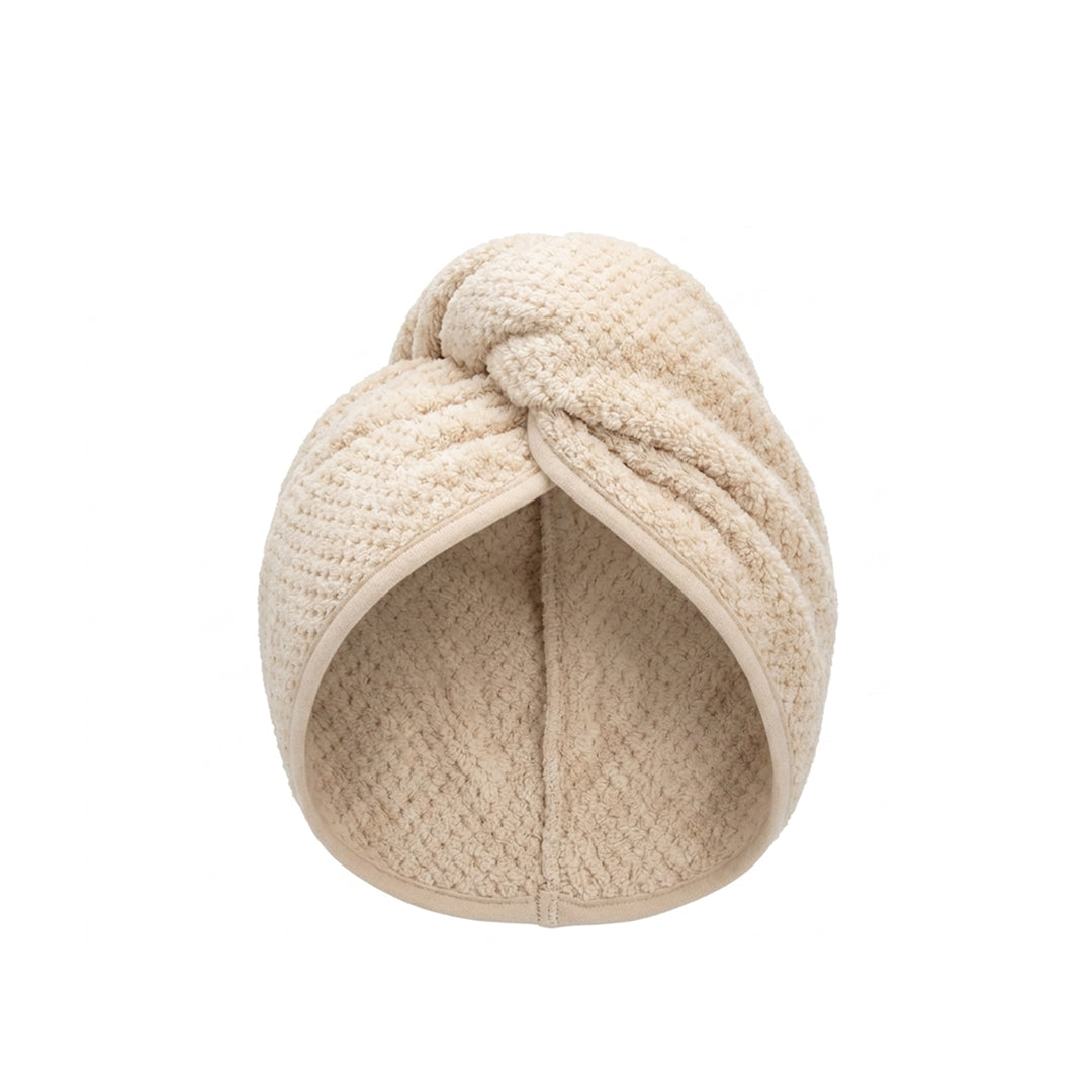 Beige knitted headband on a white background