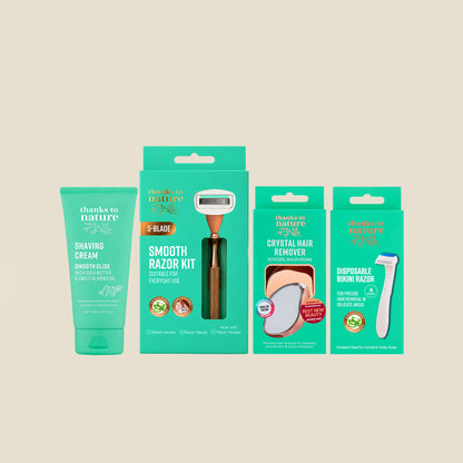 A skincare grooming set from thanks to nature, including a teal shaving cream tube, a boxed smooth razor kit, a crystal hair remover package, and a disposable razor, arranged on a light beige background.