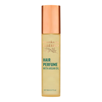 Hair perfume bottle with argan oil on a white background
