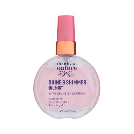Shine & Shimmer Oil Mist bottle with pink cap on a white background