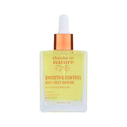 Bottle of 'thanks to nature' smooth & control anti-frizz hair oil with a dropper on a white background