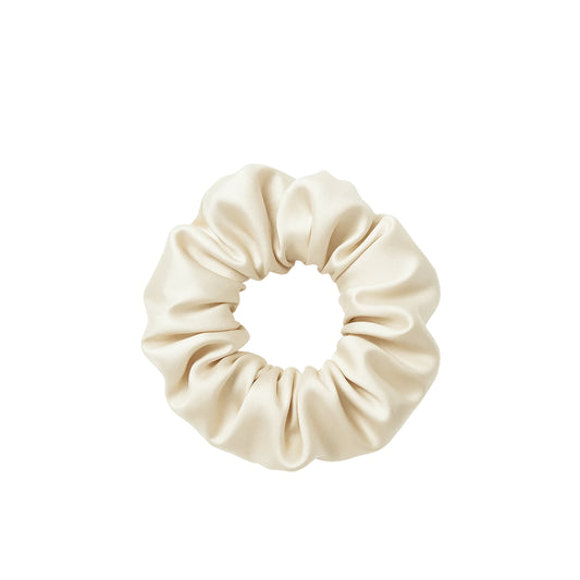 Beige scrunchie on a white background